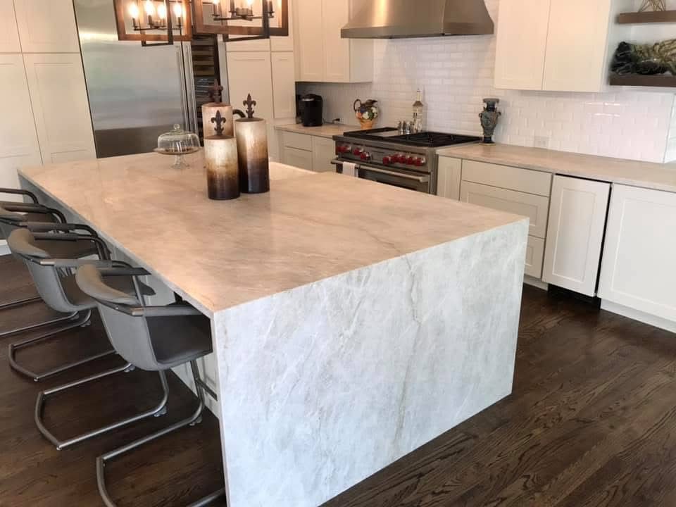 Cream quartzite waterfall island — a real Precision Granite & Marble project near Pea Ridge, AR.