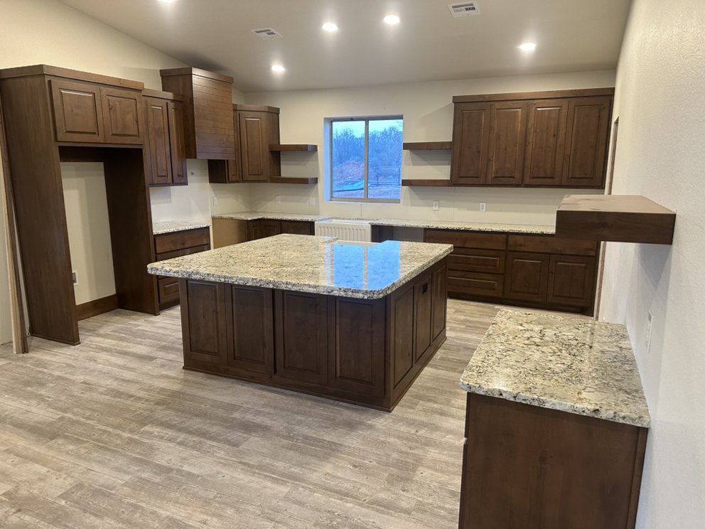 Granite countertops with an oversized kitchen island — a real Precision Granite & Marble project.